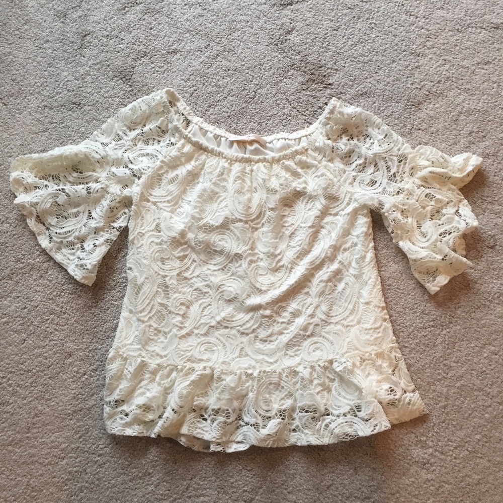 Lace flared sleeve top.